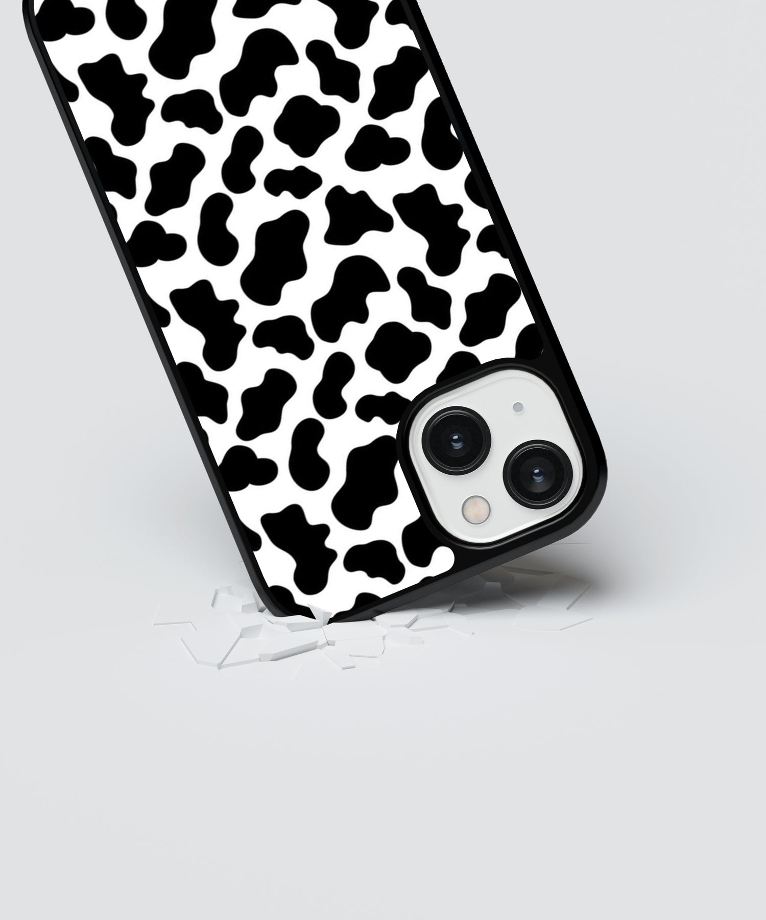 Black and white animal print iPhone case with protective shock-absorbing design on a smartphone
