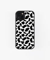 Black and white animal print iPhone case with cow pattern design and black edge protection