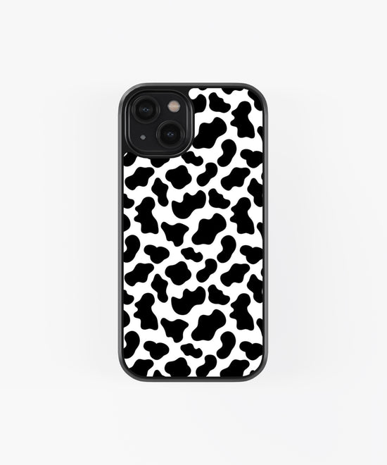 Black and white animal print iPhone case with cow pattern design and black edge protection