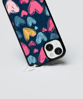 Heart design phone case with colorful hand-drawn hearts on a dark blue background on a smartphone